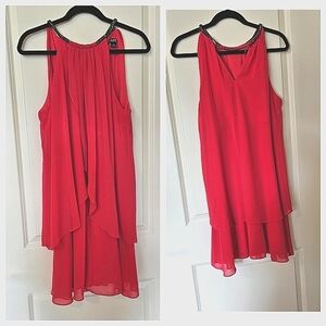 Charming pink dress from SLNY is fluffy and features an adjustable neckline